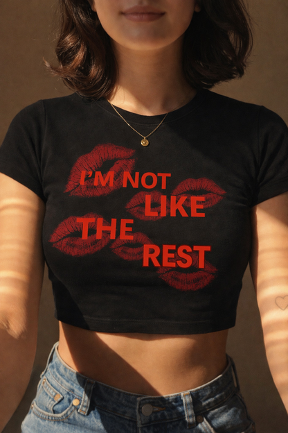I'M NOT LIKE THE REST BABY TEE